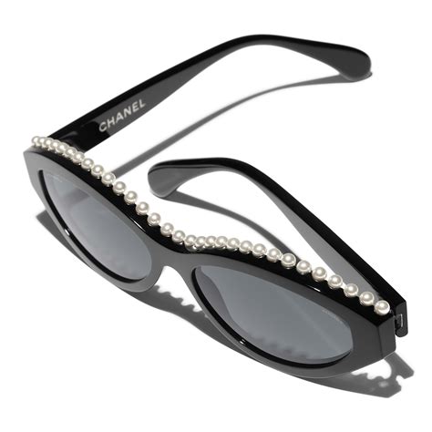 chanel oval sunglasses with pearl|Chanel sunglasses with white trim.